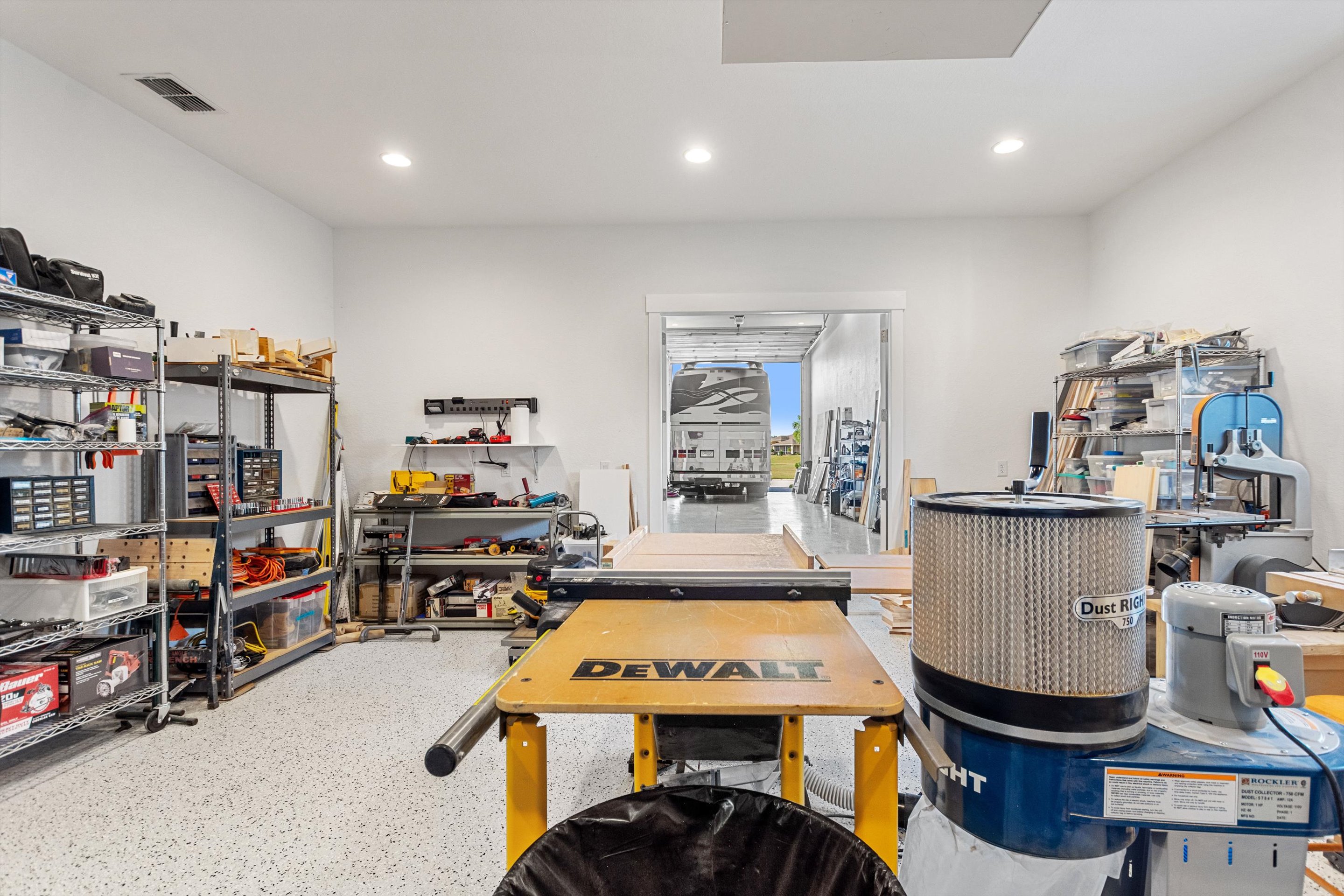 Workshop interior with tools and direct view through to the lift bay